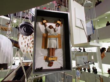 Another one of Cattelan's intersection between the worlds of fine art and Catholicism: a figures as a crucifixion inside an art shipping crate, also from 2007.